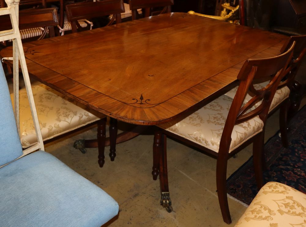 A Regency ebony inlaid mahogany tilt top dining table, W.158cm, D.100cm, H.72cm